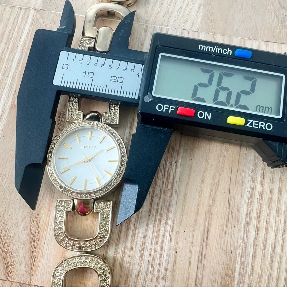 DKNY ladies gold tone crystal studded bracelet watch NEW BATTERY